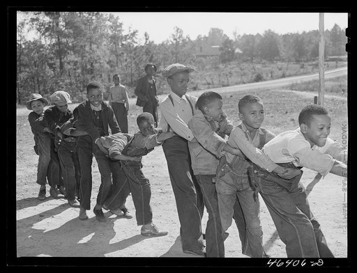 Untitled photo, possibly related to: Boyd Jones, playing tug-of-war with class mates during play period at the Alexander Community School in Greene County, Georgia