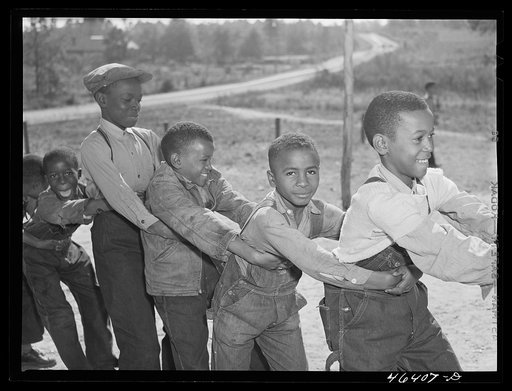 Boyd Jones, playing tug-of-war with class mates during play period at the Alexander Community School in Greene County, Georgia