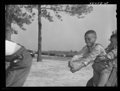 Untitled photo, possibly related to: Boyd Jones, playing tug-of-war with class mates during play period at the Alexander Community School in Greene County, Georgia