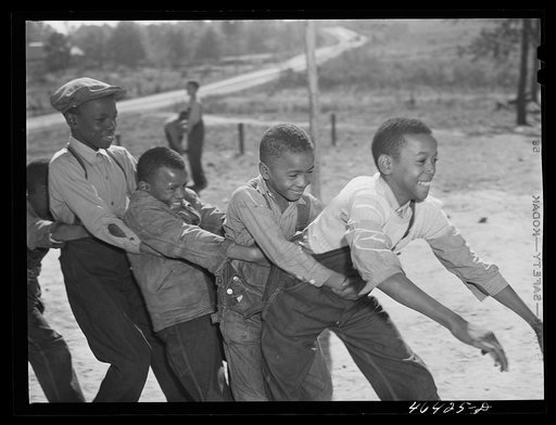 Untitled photo, possibly related to: Boyd Jones, playing tug-of-war with classmates during play period at the Alexander Community School in Greene County, Georgia