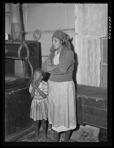 Untitled photo, possibly related to: Mrs. Buck Grant FSA (Farm Security Administration) client, with her canned goods. Near Woodville, Greene County, Georgia