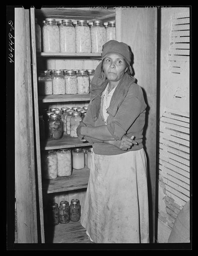 Untitled photo, possibly related to: Mrs. Buck Grant FSA (Farm Security Administration) client, with her canned goods. Near Woodville, Greene County, Georgia