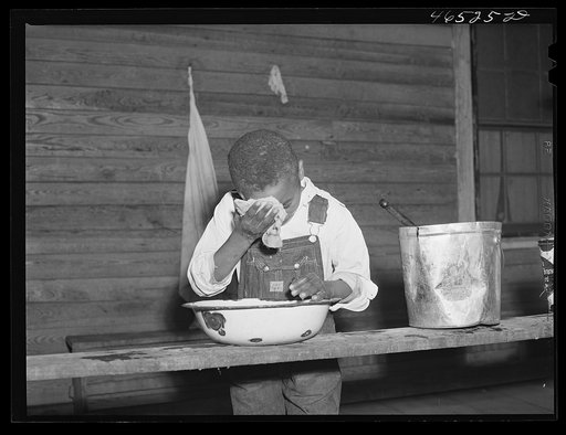 Untitled photo, possibly related to: Boyd Jones washing his face on the back porch of his house, Greene County, Georgia