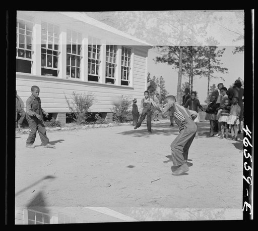 Untitled photo, possibly related to: Boyd Jones playing dodge ball during recess at the Alexander Community School, Greene County, Georgia