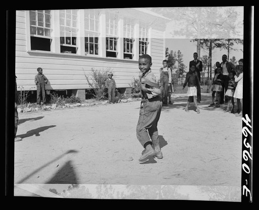 Untitled photo, possibly related to: Boyd Jones playing dodge ball during recess at the Alexander Community School, Greene County, Georgia