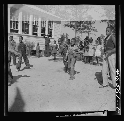 Untitled photo, possibly related to: Boyd Jones playing dodge ball during recess at the Alexander Community School, Greene County, Georgia