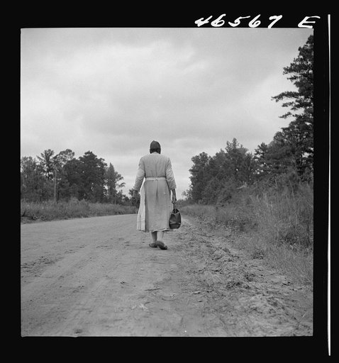 Untitled photo, possibly related to: Midwife going on a call, carrying her kit, near Siloam, Greene County, Georgia