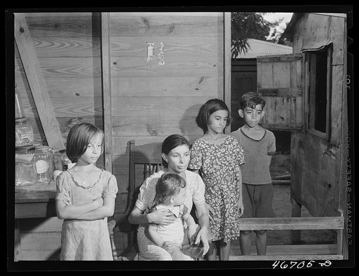 Bayamon, Puerto Rico (vicinity). Family living in an area which is to be taken by the Army