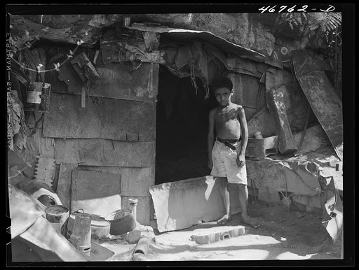 Ponce, Puerto Rico. A cave in slum area in which two people live