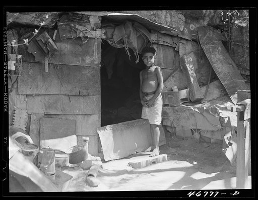 Untitled photo, possibly related to: Ponce, Puerto Rico. A cave in slum area in which two people live