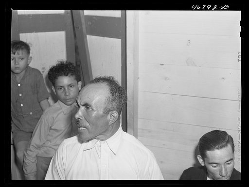 Untitled photo, possibly related to: Corozal, Puerto Rico (vicinity). Ecequiel Irene, playing the "guiro" at the tenant purchase celebration at his house