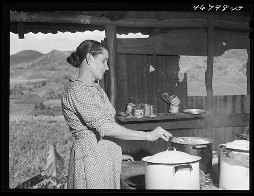 Corozal, Puerto Rico (vicinity). Mrs. Ecequiel Irene cooking "pastellas" during the tenant purchase celebration at her home