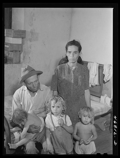 Untitled photo, possibly related to: Frederiksted, Saint Croix, Virgin Islands (vicinity). Puerto Rican family living in one of the villages reconditioned by the Virgin Islands Company. The Puerto Rican population in the islands has increased in the last decade