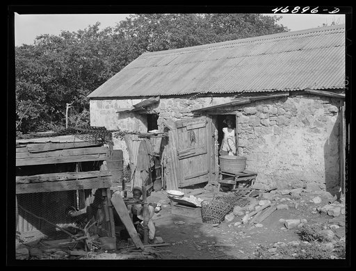 Untitled photo, possibly related to: Saint John, Saint Croix Island, Virgin Islands. Village house divided off into rooms, one for each family