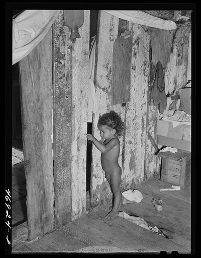 Barren Spot, Saint Croix Island, Virgin Islands. Child in the home of a Puerto Rican family