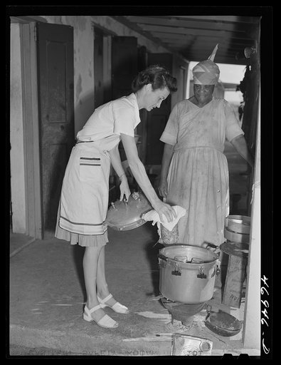 Frederiksted (vicinity), Saint Croix Island, Virgin Islands. Miss Tippin, FSA (Farm Security Administration) home demonstration agent, teaching a FSA borrower how to use a pressure cooker