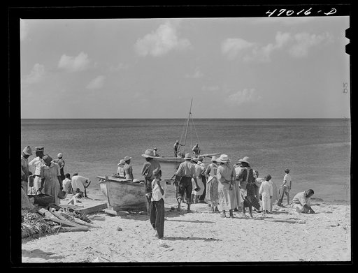 Frederiksted, Saint Croix Island, Virgin Islands. Housewives at the seashore waiting for the fishing boats to come in