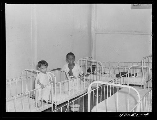 Frederiksted, Saint Croix, Virgin Islands. Child on the left, in the children's ward of the Frederiksted hospital, is suffering from severe malnutrition