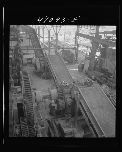 Untitled photo, possibly related to: Saint Croix Island, Virgin Islands. Reconditioning machinery in the Bethlehem sugar mill