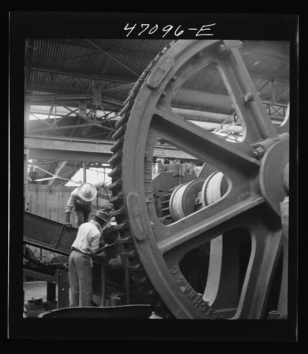 Untitled photo, possibly related to: Saint Croix Island, Virgin Islands. Reconditioning machinery in the Bethlehem sugar mill