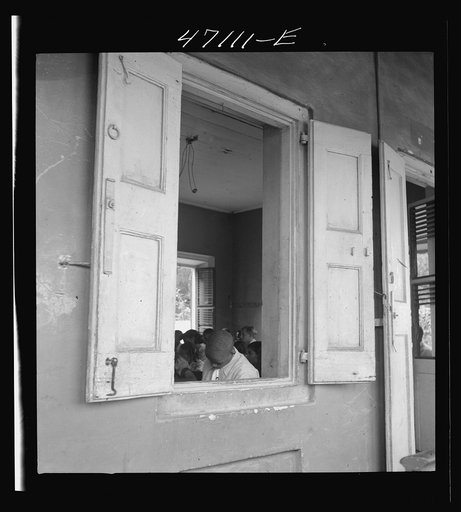 Untitled photo, possibly related to: Christiansted, Saint Croix Island, Virgin Islands. At a window of the Christiansted high school