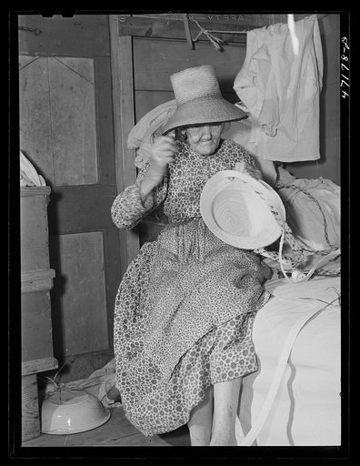 Untitled photo, possibly related to: French village, a small settlement on Saint Thomas Island, Virgin Islands. Making a hat out of palm leaf to be sold at the handicrafts cooperative. Many people in the colony earn extra money this way
