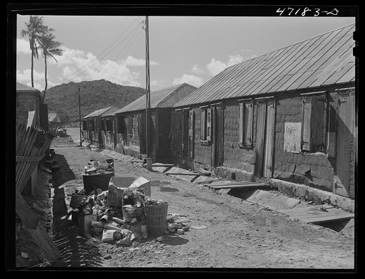 Charlotte Amalie, Saint Thomas Island, Virgin Islands. A group of long row houses near the water front