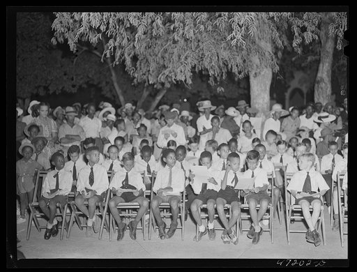 Untitled photo, possibly related to: Charlotte Amalie, Saint Thomas Island, Virgin Islands. Choir singing Christmas carols at the Red Cross meeting held in the square