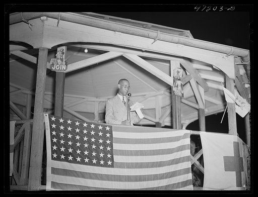 Charlotte Amalie, Saint Thomas Island, Virgin Islands. The master of ceremonies at the Red Cross meeting held in the square