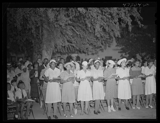Charlotte Amalie, Saint Thomas Island, Virgin Islands. Choir singing Christmas carols at the Red Cross meeting held in the square