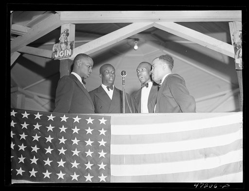 Charlotte Amalie, Saint Thomas Island, Virgin Islands. A quartette singing at the Red Cross meeting held in the square
