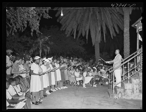 Charlotte Amalie, Saint Thomas Island, Virgin Islands. Choir singing Christmas carols at the Red Cross meeting held in the square