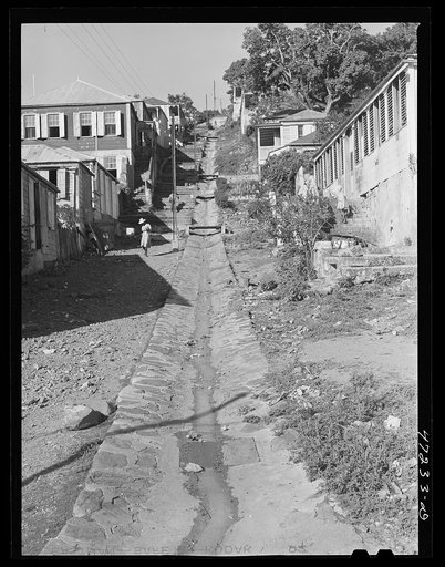 Charlotte Amalie, Saint Thomas Island, Virgin Islands. Open sewer on a hillside