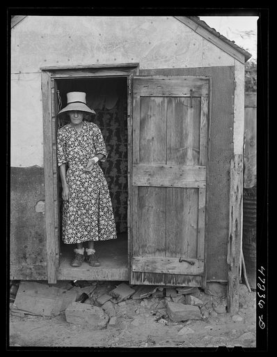 French village, a small settlement on Saint Thomas Island, Virgin Islands. French woman living in one of the tiny hillside homes in the French village