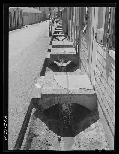 Charlotte Amalie, Saint Thomas Island, Virgin Islands. Open sewer along a street