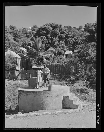 Charlotte Amalie, Saint Thomas Island, Virgin Islands. Getting water out of a public well