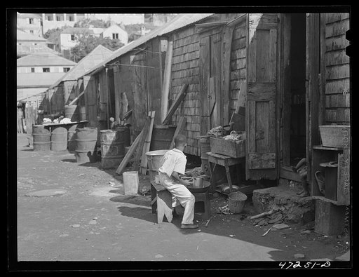 Untitled photo, possibly related to: Charlotte Amalie, Saint Thomas Island, Virgin Islands. Painting furniture and cleaning house in a slum section