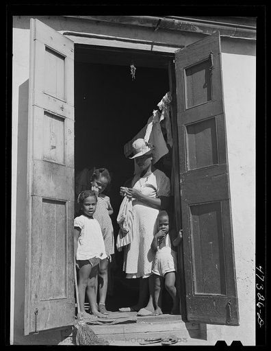 Charlotte Amalie, Saint Thomas Island, Virgin Islands. Family living in a slum section near the waterfront