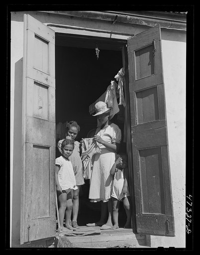 Untitled photo, possibly related to: Charlotte Amalie, Saint Thomas Island, Virgin Islands. Family living in a slum section near the waterfront