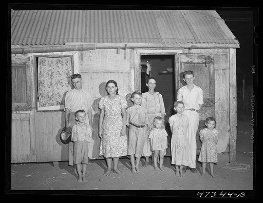 Untitled photo, possibly related to: French village, a small settlement on Saint Thomas Island, Virgin Islands. French family living in one of the tiny houses in the French village, a small settlement. Several of the children suffer from an eye disease that necessitates a delicate operation possible