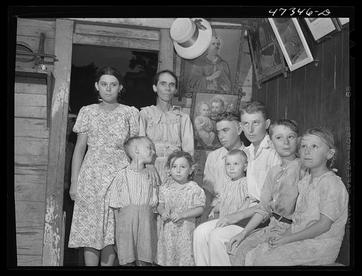 French village, a small settlement on Saint Thomas Island, Virgin Islands. French family living in one of the tiny houses in the French village, a small settlement. Several of the children suffer from an eye disease that necessitates a delicate operation possible only in the United States