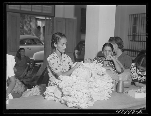 Untitled photo, possibly related to: Santurce, Puerto Rico. Women working in the Rodriguez needlework factory where the minimum wage is six dollars a week