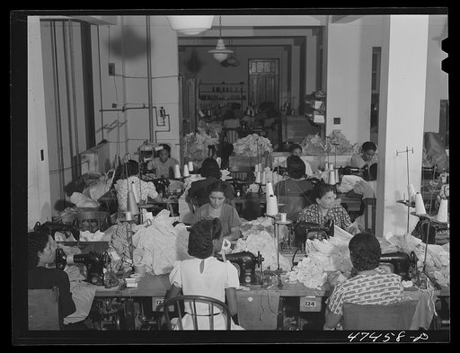 Santurce, Puerto Rico. Women working at the Rodriguez needlework factory. Minimum wage is six dollars a week