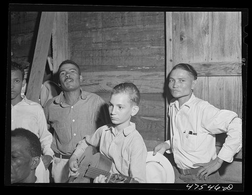 Untitled photo, possibly related to: Guanica, Puerto Rico (vicinity). At a Three Kings' eve party in a tenant farmer's home in the sugar country