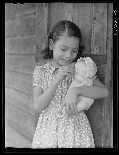 Guanica, Puerto Rico (vicinity). One of the children of a tenant farmer and her Three Kings' day present