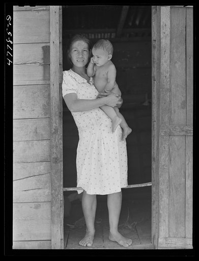 Untitled photo, possibly related to: Yauco, Puerto Rico (vicinity). Wife and child of a tenant farmer in the hills