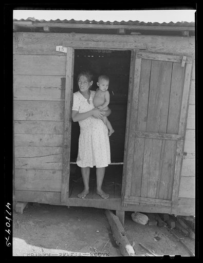 Yauco, Puerto Rico (vicinity). Wife and child of a tenant farmer in the hills