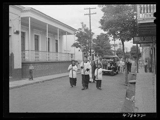 Yauco, Puerto Rico. A funeral procession on a street