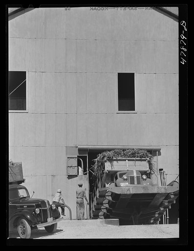 Ensenada, Puerto Rico. Apparatus for tilting the truck in order to slide the sugar cane down into the grinding mills at the South Puerto Rico Sugar Company