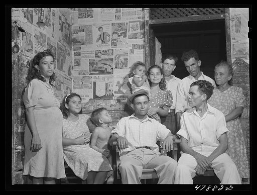 Guayanilla, Puerto Rico. Family of a sugar worker living in one of the company houses behind the mill. All these people live in the same house